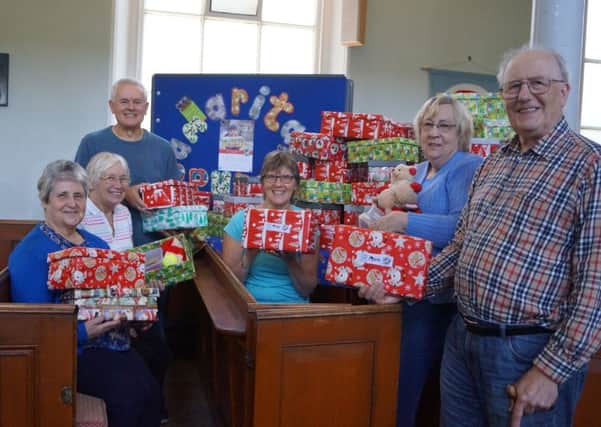 Wrappers and packers with some of the boxes filled on Saturday morning in Market Rasen Methodist Church EMN-180110-062301001