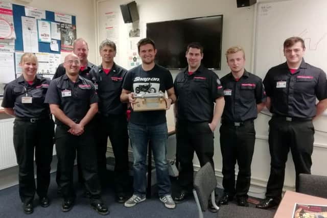 Stuart Martin surrounded by his firefighter colleagues