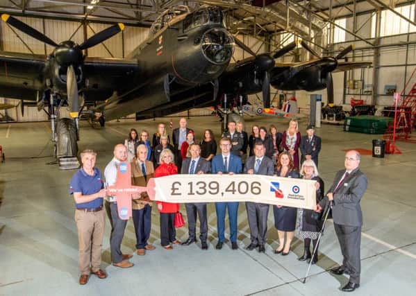 A scene from the presentation of funds at the Battle of Britain Memorial Flight Visitor Centre.