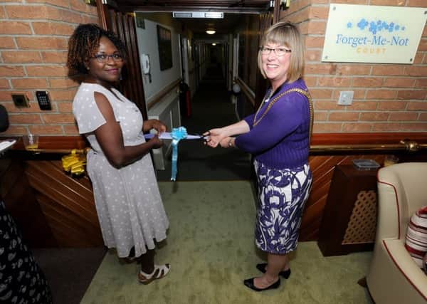 Mayor of Boston Coun Judith Skinner gets ready to cut the ribbon, with Dupe Adewuyi, manager of Hunters Creek care home, standing by.