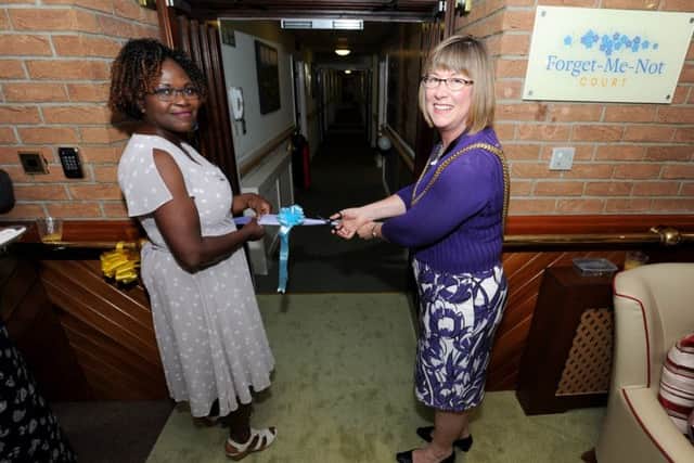 Mayor of Boston Coun Judith Skinner gets ready to cut the ribbon, with Dupe Adewuyi, manager of Hunters Creek care home, standing by.