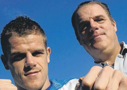 Callum Johnson shows off his Commonwealth gold with dad Paul.