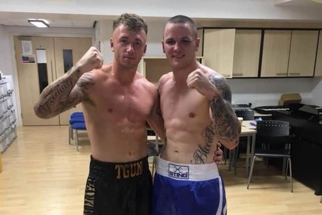 Thomas Pogson, left, with Brandon Rees.