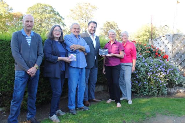 Allison Gott, manager at Goodbarns Yard, second from right, receives the Pub in Bloom award from Kevin Charity, chief executive of competition sponsors Coaching In nGroup. Also pictured, from left, judge Paul Collingwood, Boston in Bloom chairman Alison Fairman holding the winning gift voucher, gardener David Luto, and, far right, judge Bridget Sykes.