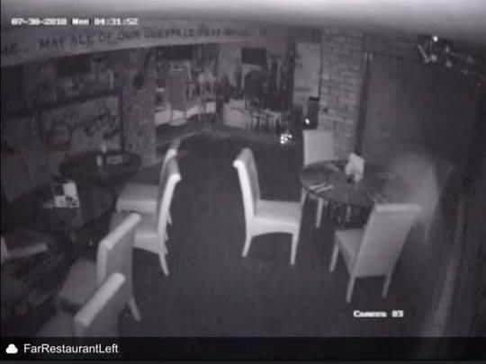 The CCTV still showing a ghostly mist to the rear of the 'Empire' table (pictured right).
