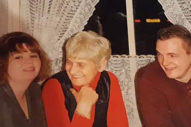 Andrew Capon (right) pictured with his mum and sister before he went missing 20 years ago. ANL-180110-170348001