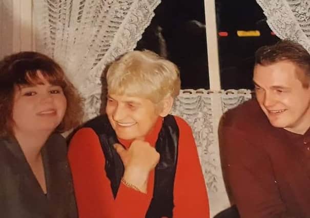 Andrew Capon (right) pictured with his mum and sister before he went missing 20 years ago. ANL-180110-170348001