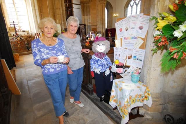 The Willoughby Wisps Ladies Group scarecrow display in Silk Willoughby Church - viewed by organiser Robbie Mann and churchwarden Sue Logan. EMN-180928-093841001