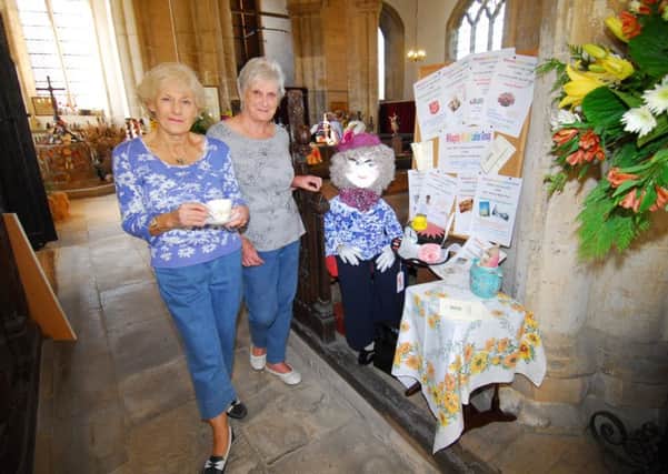 The Willoughby Wisps Ladies Group scarecrow display in Silk Willoughby Church - viewed by organiser Robbie Mann and churchwarden Sue Logan. EMN-180928-093841001
