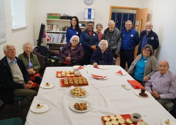 Some of the store's senior shoppers and visitors from The Poplars with the staff who are running the drop-in coffee sessions once a month EMN-180910-110616001