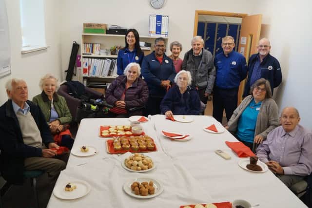 Some of the store's senior shoppers and visitors from The Poplars with the staff who are running the drop-in coffee sessions once a month EMN-180910-110616001