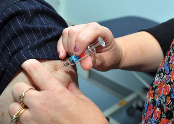 People are being urged to get the flu vaccine as soon as possible