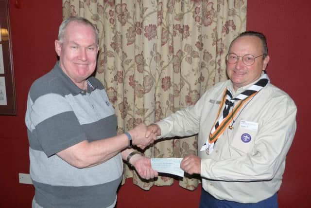 Richard Arden receives the cheque from John Ginty