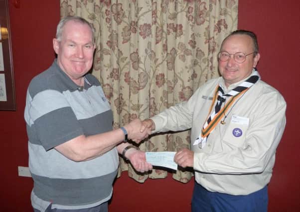 Richard Arden receives the cheque from John Ginty