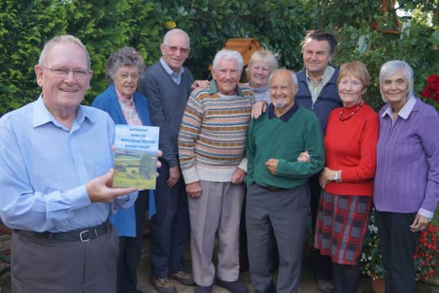 George Kinghorn, pictured left holding the anthology, with some of the other members EMN-180910-084905001