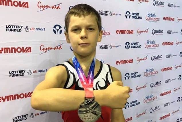 Logan Somers displaying his British silver medal EMN-180510-111229002