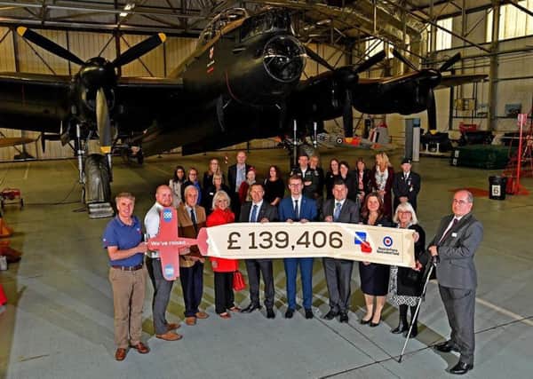 A presentation took place in the RAF Battle of Britain Memorial Flight hangar at RAF Coningsby. EMN-180510-152144001