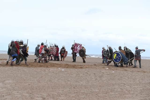 Rival Viking groups battle on Skegness Central Beach. Photo: MSKP-061018-39 ANL-180810-120543001