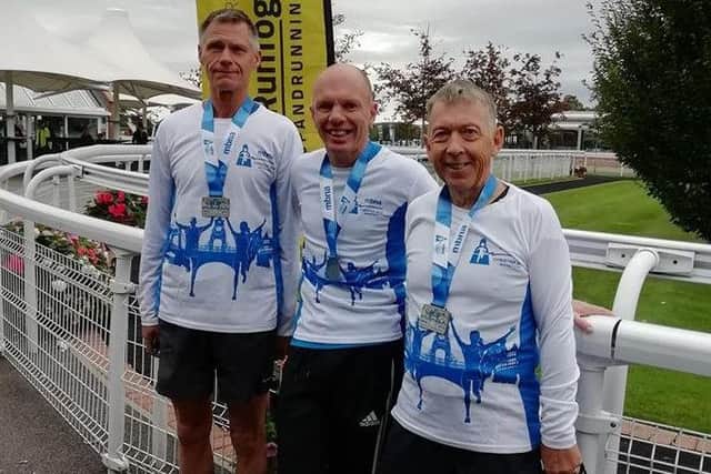 Marathon men Phil, Mark and Robin in Chester. M1wEA29bpCc-VN9WO_nn