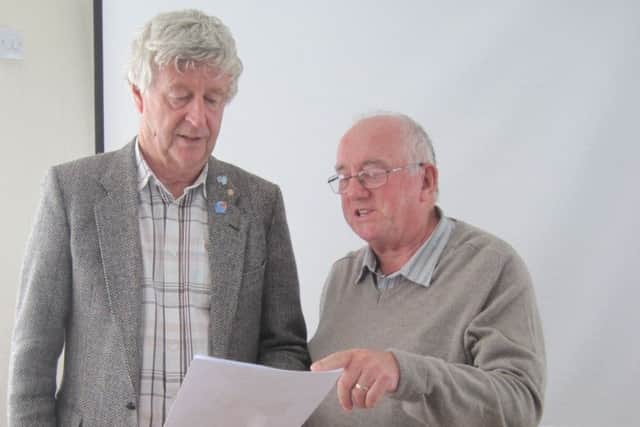 Alan Dennis shows Rotary Secretary Jo Bowman the plans for developing the old Caistor Co-op building. EMN-181015-081007001