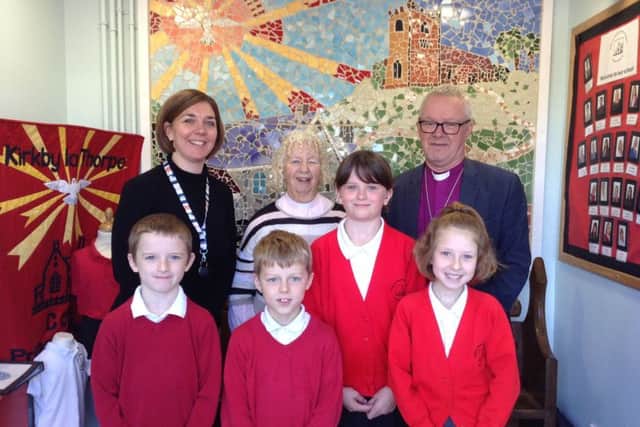 Head teacher Katies Graveil, Rector Val Greene, and the Bishop of Grimsby with some of the pupils. Image supplied.