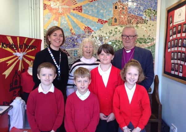 Head teacher Katies Graveil, Rector Val Greene, and the Bishop of Grimsby with some of the pupils. Image supplied.