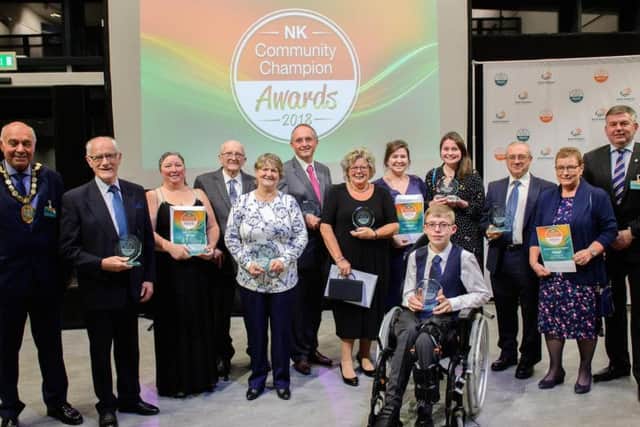 Winners of this year's NK Community Champions Awards along with chairman of NKDC Coun Geoff Hazelwood and Leader of the Council, Coun Richard Wright.