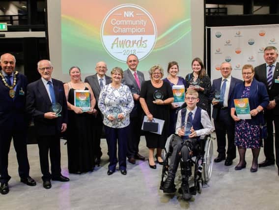 Winners of this year's NK Community Champions Awards along with chairman of NKDC Coun Geoff Hazelwood and Leader of the Council, Coun Richard Wright.