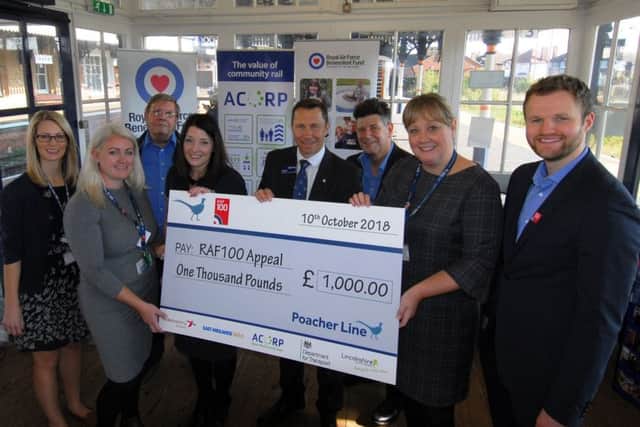 Mark Quinn, Regional Director for the RAF Benevolent Fund receives the cheque for £1,000 from the RAF100 events on the Poacher Line at Sleaford station. EMN-181110-141815001