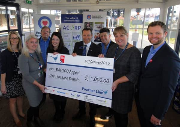 Mark Quinn, Regional Director for the RAF Benevolent Fund receives the cheque for Â£1,000 from the RAF100 events on the Poacher Line at Sleaford station. EMN-181110-141815001