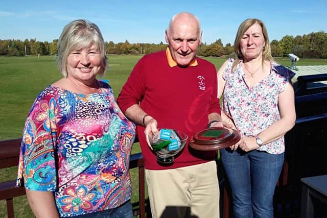 Tony Taylor is pictured receiving the Tony Snell Memorial Trophy from Tony's daughters Sandra Reedman and Jane Hodgson.