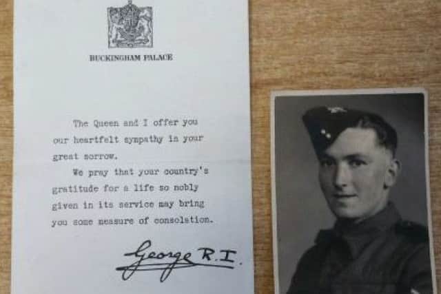 The sympathy letter from King George VI and one of the photos in the bag. EMN-181210-095418001