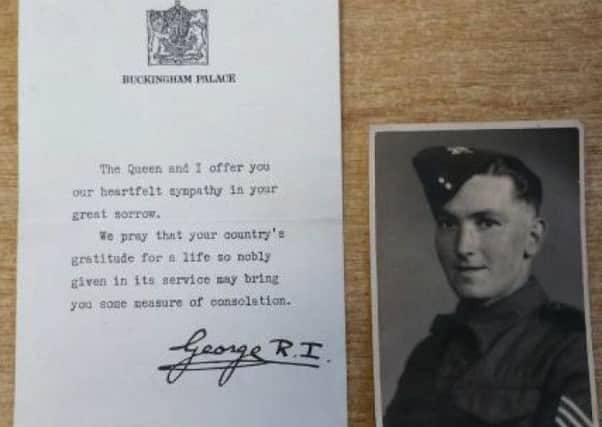 The sympathy letter from King George VI and one of the photos in the bag. EMN-181210-095418001