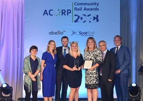 Poacher line partnership reoresentatives receive their award at the ACORP Community Rail Awards. EMN-181210-110504001