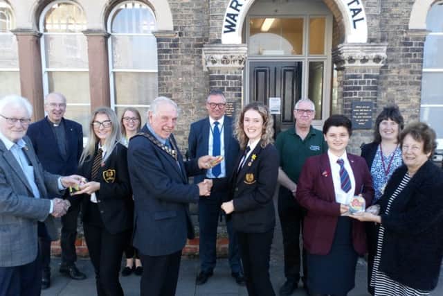 Mayor Coun Brian Burbidge meets Banovallum School student Heather McNeill (centre) who deisgned a lapel badge for the Remembrance events.