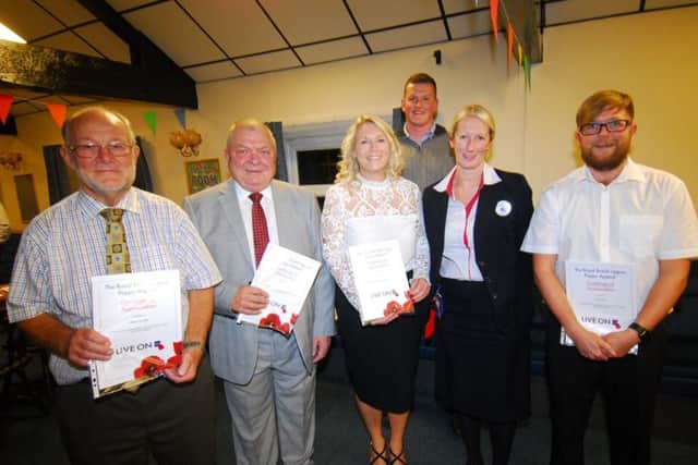 Sleaford business representatives with their certificates of thanks from the British Legion. EMN-181210-182835001