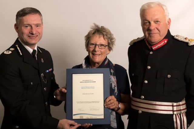 Deputy Chief Constable Bill Skelly pictured with Christine Ivett and the Lord Lieutenant of Lincolnshire, Toby Dennis.
