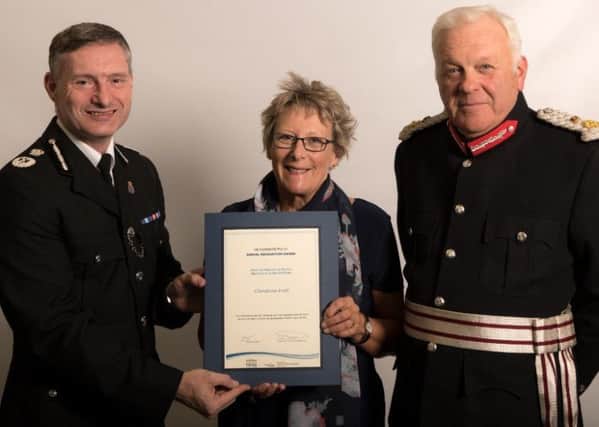 Deputy Chief Constable Bill Skelly pictured with Christine Ivett and the Lord Lieutenant of Lincolnshire, Toby Dennis.