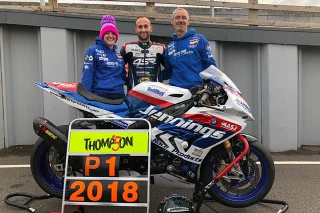 Jack Thompson with his mechanics Simon Heaton and Jo Hall.