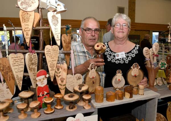 William and Fiona Elkington with their work at the latest Lincolnshire Association of Wood Turners open day at Leasingham Village Hall.