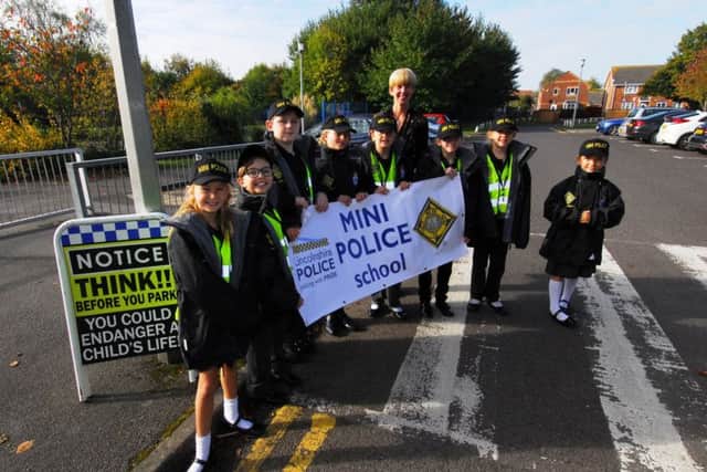 Headteacher Helen Duckett and her new Mini Police at Winchelsea School, Ruskington. EMN-181019-120037001