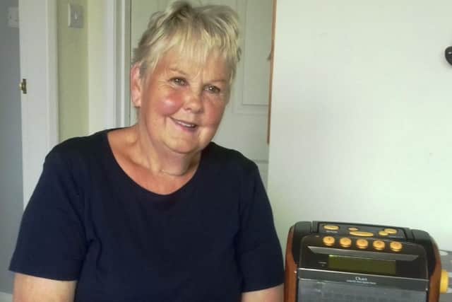 One of the recipients of the free the audio device supplied by the British Wireless for the Blind Fund (BWBF). Image supplied.