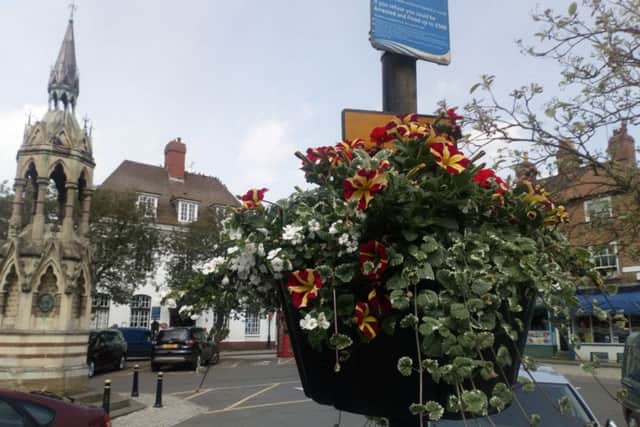 A colourful basket of flowers in the Market Place helped win over judges
