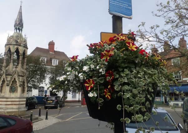 A colourful basket of flowers in the Market Place helped win over judges