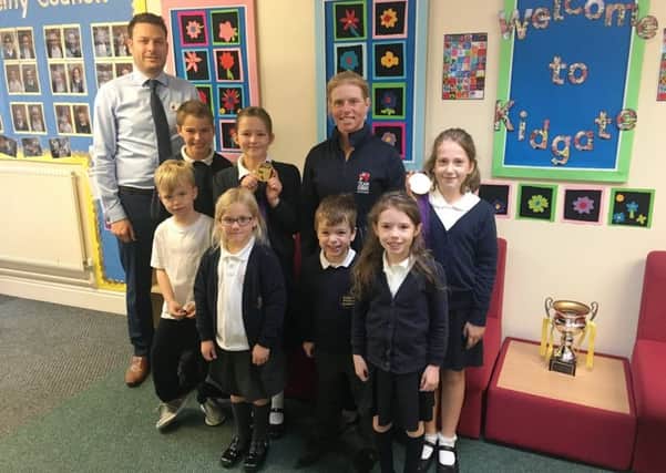 Ros Canter with head teacher, Mr Lidbury, and pupils at Kidgate Primary Academy in Louth last week.