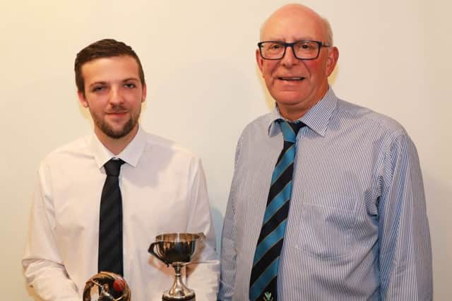 Reg Percival presenting Ben Barrick with the 2nd XI Bowling Trophy EMN-181019-100349002