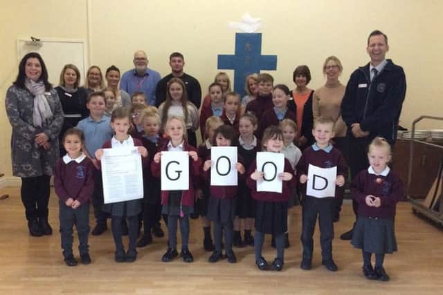 North Cotes staff and pupils celebrate their Ofsted success.