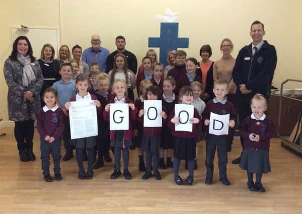 North Cotes staff and pupils celebrate their Ofsted success.