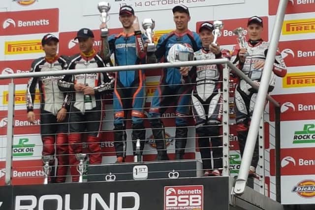 Ellis and Richardson climb the top step of the podium. flanked by multiple world champions Reeves and Wilks, and the Birchalls (right) EMN-181019-130540002