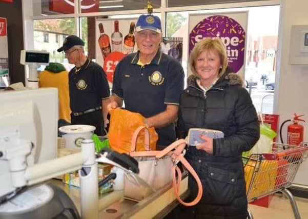 Sleaford Rotarians bag packing at Sainsbury's in Sleaford for World Polio Day. EMN-181030-123158001